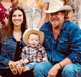 Kristen Robinson with her husband and their son.